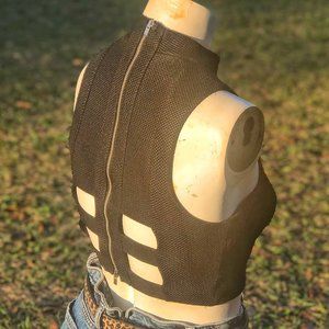 Black zip up crop top with square cut outs in the back